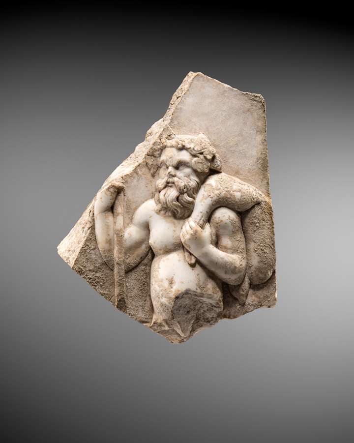 Marble relief fragment representing a Silenos